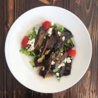 Goat Cheese and Portobello Salad · Baby field greens and grape tomatoes topped with grilled portobello mushrooms and goat cheese.