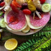 Cold Antipasto Salad · House salad topped with fresh mozzarella, giardiniera, provolone, salami, pepperoni, ham and...