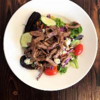 Steak and Gorgonzola Salad · House salad topped with crumbled Gorgonzola and sauteed slices of steak.