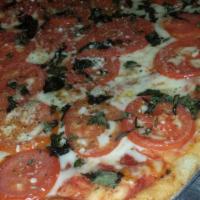 Margherita Pizza · Sliced plum tomatoes, fresh basil, fresh garlic, oregano, mozzarella and Romano.