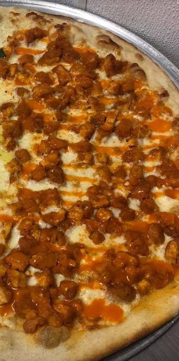 Buffalo Chicken Pizza · Crispy chicken tossed in creamy bleu cheese and hot sauce. 