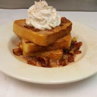 Cinnamon Caramel French Toast Breakfast Special · 3 slices of French toast served in a bowl with crumbled bacon topped with hot caramel and wh...