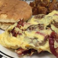 Meat Lovers Omelet · Sausage, bacon, ham, and cheddar cheese.
