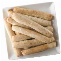 Breadsticks · Fresh oven-baked dough. Served with your choice of two dipping sauces.