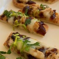 BBQ Chicken Flatbread · Golden Toasted Flatbread Topped with BBQ Sauce, Mozzarella Cheese, Chicken Breast, Leeks and...