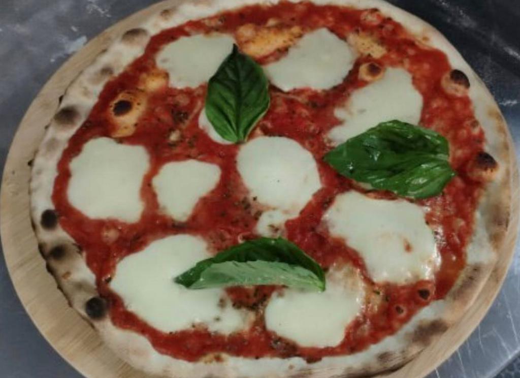 Napoletana Pizza · Parmesan, fresh mozzarella, tomato sauce, and basil.
