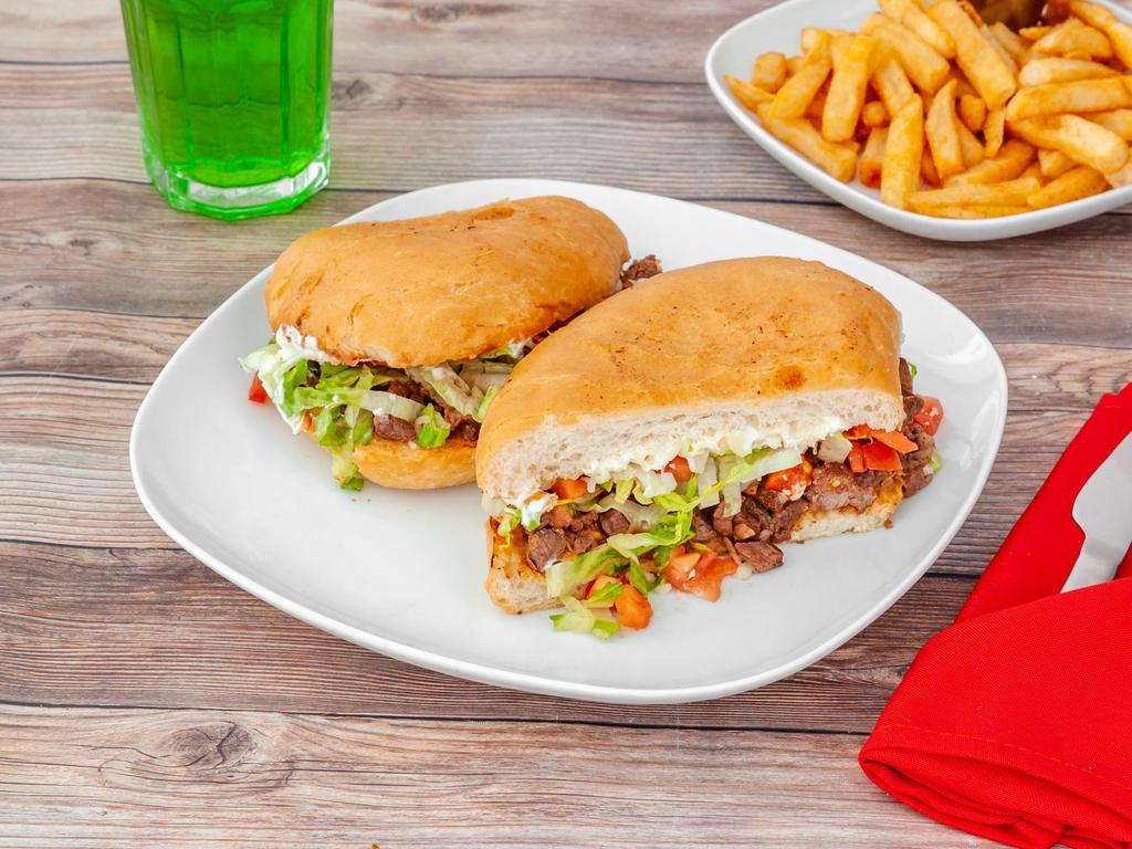 Steak Torta  · Asada. Mexican sandwich served with beans, cheese, lettuce, tomato, and sour cream.