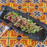 Tartar de Atun · Fresh tuna tartar with chive, olive oil and low sodium sauce. 