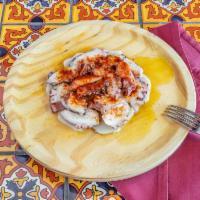 Pulpo a la Gallega · Pieces of octopus on slices of potatoes cooked with olive oil and sweet paprika. 