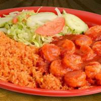 Camarones a la Diabla · Shrimp with hot sauce, served with rice and salad.