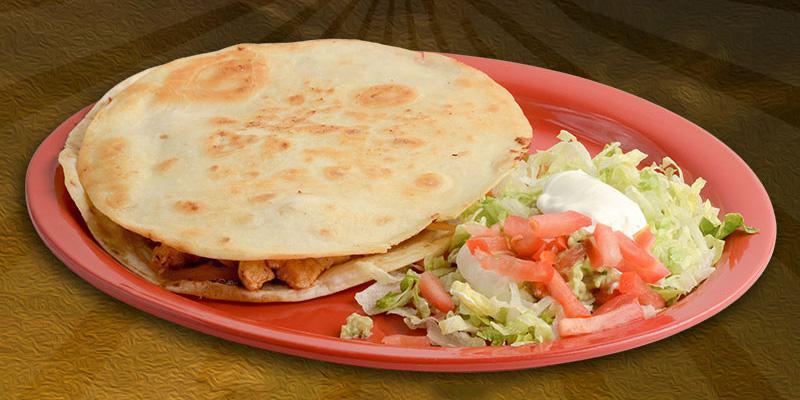 Quesadilla Ranchera · Choice of steak or chicken served with onions, tomatoes, bell pepper and guacamole salad.