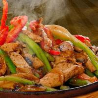 Fajitas · Choice of chicken or steak, sauteed with onions, bell peppers and tomatoes. Served with guac...