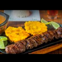 Churrasco Asado o al Carbon · 15 oz. Grilled or smoked sirloin steak with rice, salad, beans and green plantain or french ...