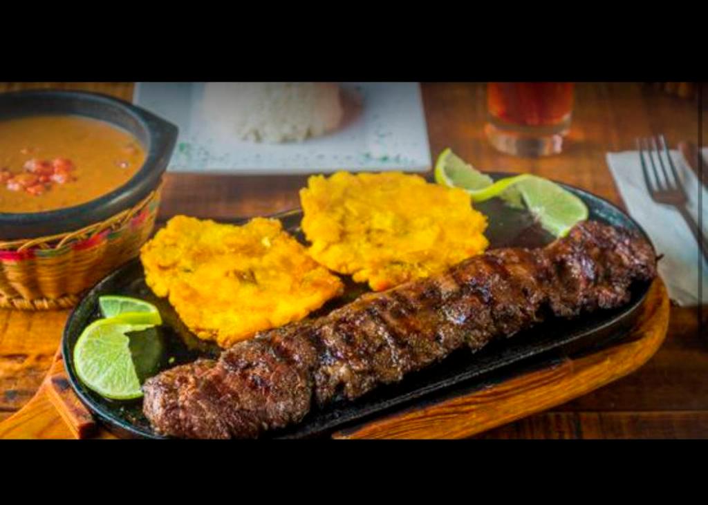 Churrasco Asado o al Carbon · 15 oz. Grilled or smoked sirloin steak with rice, salad, beans and green plantain or french fries.