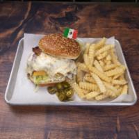 Chilamburguesa · Mexican burger with, ham, panela cheese, bacon, pineapple and avocado sauce. Served with fri...