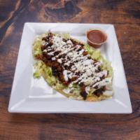 Huaraches · Long Mexican tortilla, topped with lettuce, Parmesan cheese, cream and your choice of meat p...