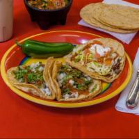 Arranchera Taco Dinner · Skirt steak. 3 tacos with side of rice & beans.