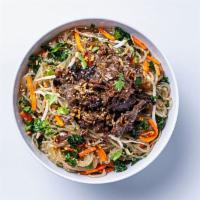 NOODLES · Delicious chewy noodles tossed with kale, carrots, roasted sesame seeds, and a garlic-ginger...