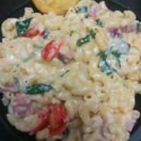 Ham and Cheese Mac · Swiss Cheese, Gouda Cheese, Ham, Spinach and Tomatoes. Severed with a mini Corn muffin 