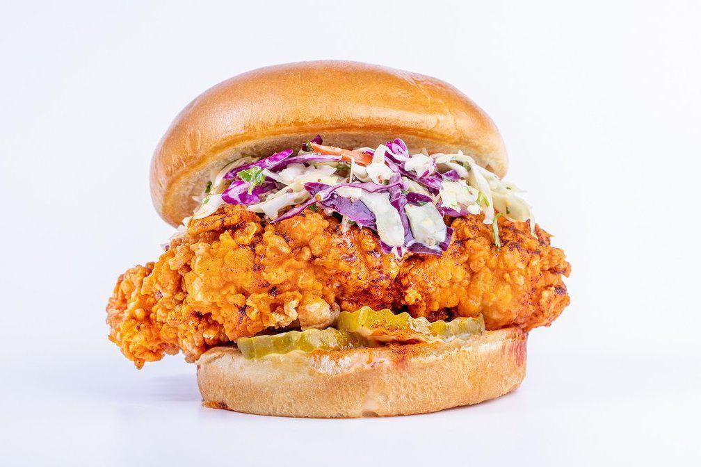 Original Chicken Sandwich · Hand breaded and battered using our custom recipe, this is a 100% antibiotic and hormone free all white meat meat chicken breast that’s cooked to order.  Served on a toasted Brioche bun with dill pickle chips and your choice of sauce.