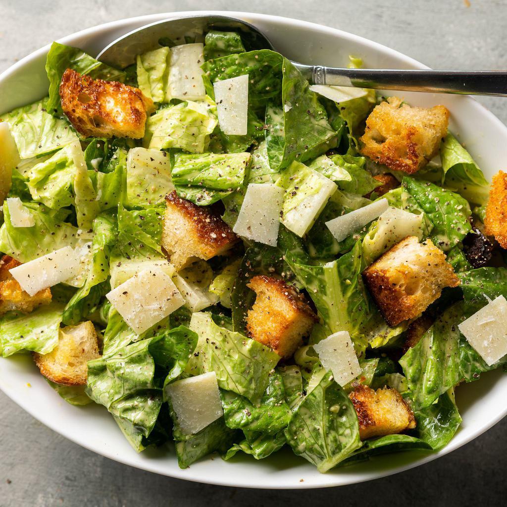 Freshly Made Classic Caesar Salad with Homemade Cesar Dressing  · This Classic Caesar Salad with romaine lettuce, homemade croutons, Parmesan cheese, and easy homemade Caesar dressing is sure to please everyone.(Romaine lettuce, croutons, Parmesan cheese and grape tomatoes)