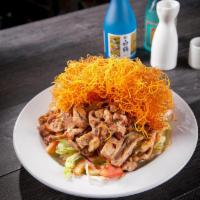 S8. Chicken Salad · Marinated chicken with house salad and sesame dressing.