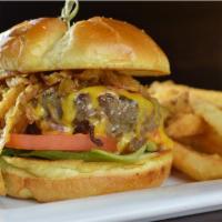 Black Label Burger · Sharp cheddar cheese, fried onions, zesty sauce, lettuce, tomatoes.
