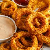Whiskey Battered Onion Rings · Fried battered onion.