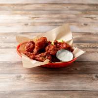 Spicy BBQ Wings · Cooked wings of a chicken coated in BBQ sauce. 