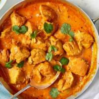 65. Chicken Curry · Boneless chicken cooked with onion, tomato based sauce and herbs and spice.