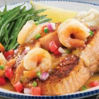 Salmon New Orleans · Blackened Atlantic salmon topped with shrimp tossed in a Cajun butter sauce. Topped with tom...