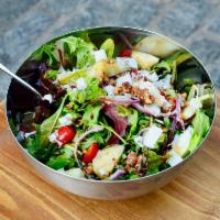 House Salad · Fresh mixed greens with grape tomatoes, cucumber, red onion, and toasted walnuts. Finished w...