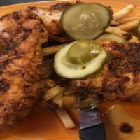NASHVILLE HOT CHICKEN PLATTER · 2 Buttermilk fried chicken breasts, Nashville hot sauce, pickles, coleslaw, hand cut fries (...