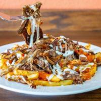 Bakkal's Loaded Fries · Fries topped with gyro meat, melted mozzarella & cedar cheese served with side Tzatziki & Ke...