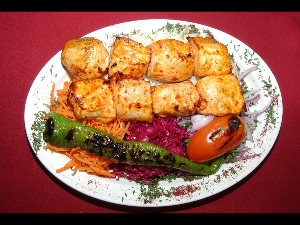 Double Chicken Shik Kebab · Hand-carved fresh chicken breast marinated in our chef’s blend of unique seasonings and chargrilled on skewers. Serve with rice and salad 