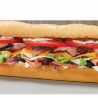 Traditional Sub · Black Angus steak, turkey, ham, cheddar, black olives, lettuce, tomatoes, onions and ranch.