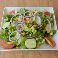 House Salad · Romaine and iceberg lettuce, tomatoes, cucumbers, red onion and croutons.