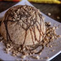 Peanut Butter Cup · Peanut butter snow, Reese's chips, chocolate syrup, cocoa powder.