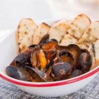 Al Mejillon Tapas · Prince Edward island mussels, spanish chorizo, roasted tomato, and chile de arbol tequila sa...