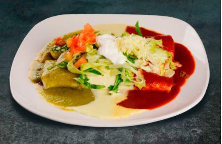Burrito Deluxe · 1 bean and 1 ground beef burrito, 1 shredded chicken and bean burrito, covered with our salsa verde, cheese sauce and red sauce, topped with shredded lettuce, cheese, sour cream and tomatoes.