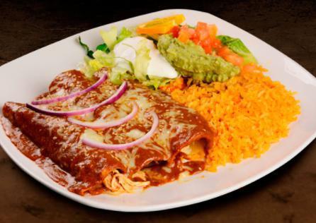 Enchiladas Poblanas · 3 chicken enchiladas topped with mole sauce and cheese, served with lettuce, sour cream, tomatoes and a side of rice.