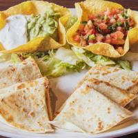 Quesadilla Supreme · A grande quesadilla grilled and stuffed with cheese, shredded beef or chicken. Served with l...