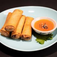Veggie Spring Rolls · Thai crispy spring rolls with vegetables & mung bean noodle stuffing, sided with sweet & sou...