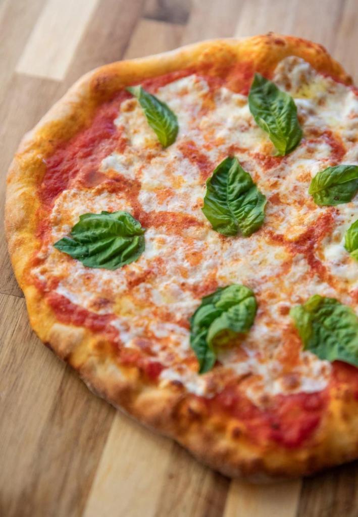 Margherita Pizza · Mozzarella Cheese, Tomato Sauce, Basil & Extra Virgin Olive Oil. Choice of Regular Thin Crust or Gluten Free Cauliflower Crust.