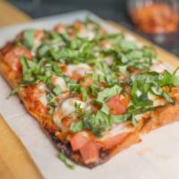 MARGHERITA PIZZA · CHOPPED TOMATOES TOPPED WITH FRESH BASIL