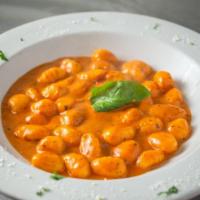 Gnocchi alla Rustica · Gnocchi pasta sauteed with marinara and pesto, finished with a touch of cream sauce.