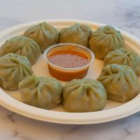 Veg Momo · 9 pieces. Dumpling filled with ground mixed vegetables, paneer with wrap.