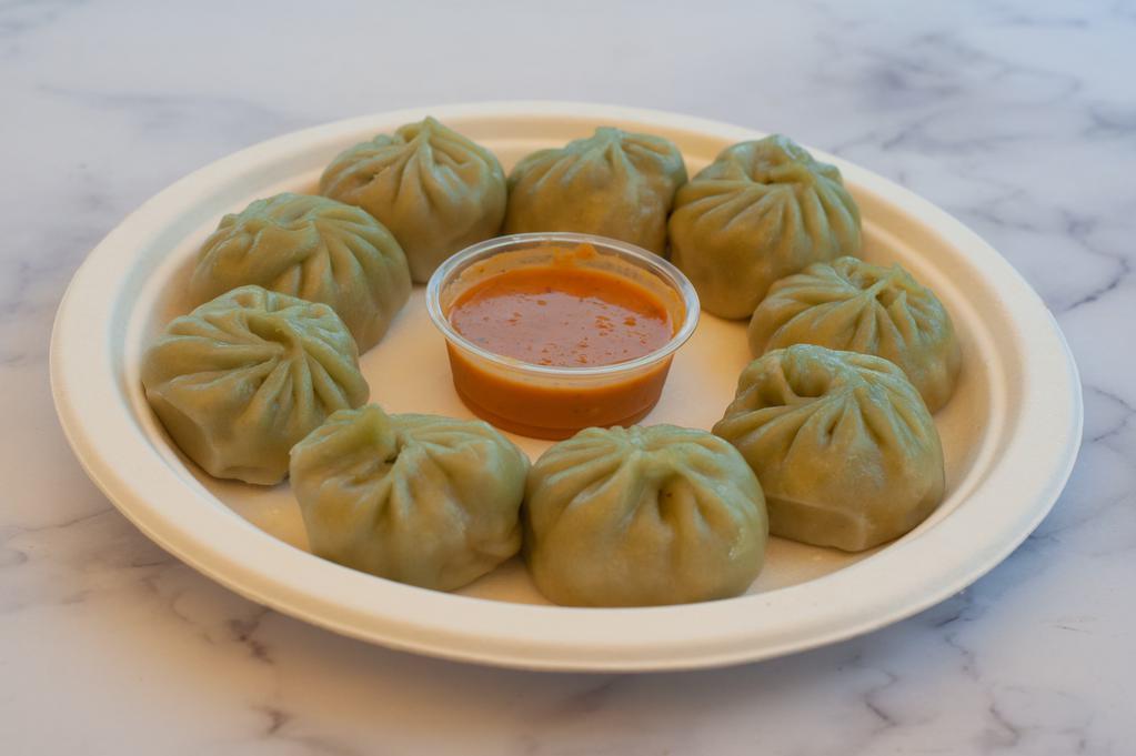 Veg Momo · 9 pieces. Dumpling filled with ground mixed vegetables, paneer with wrap.