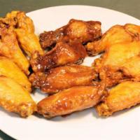 Wings  · Cooked wing of a chicken coated in sauce or seasoning. Includes fries, coleslaw and sliced b...