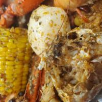 Krabby Bag · 1 Dungeness, 1 snow crab, 1/2 lb. shrimp, 1/2 lb. sausage, 2 corn, 3 potatoes, 2 eggs.


